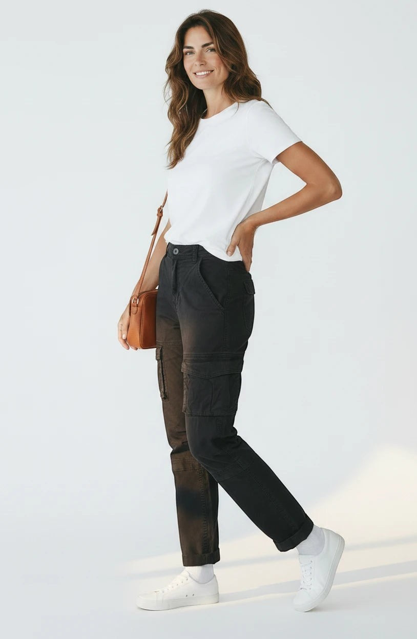 Model wearing Roxanne's black cotton-blend cargo pants with side pockets, white t-shirt, and sneakers.